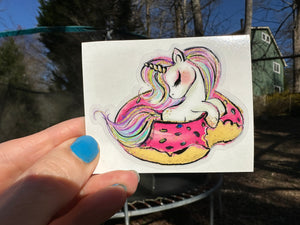 Sticker | 40i | Unicorn in Donut Float | Waterproof Vinyl Sticker | White | Clear | Permanent | Removable | Window Cling | Glitter | Holographic