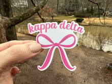 Load image into Gallery viewer, Sticker | KD_O | Kappa Delta Pink Bow | Waterproof Vinyl Sticker | White | Clear | Permanent | Removable | Window Cling | Glitter | Holographic