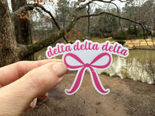 Load image into Gallery viewer, Sticker | DDD | Tri Detla Pink Bow | Waterproof Vinyl Sticker | White | Clear | Permanent | Removable | Window Cling | Glitter | Holographic