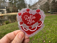 Load image into Gallery viewer, Sticker | DZ_C | Delta Zeta Heart Shaped Cake | Waterproof Vinyl Sticker | White | Clear | Permanent | Removable | Window Cling | Glitter | Holographic